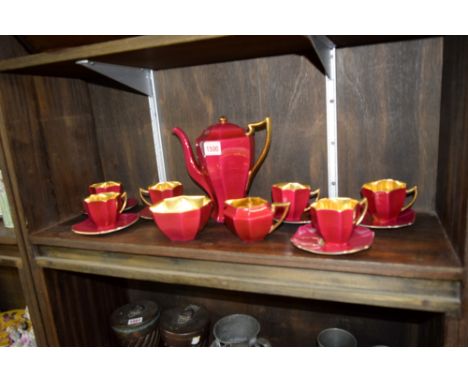A Shelley 'Queen Anne' shape raspberry and gilt coffee service.  Condition Report: good.  No visible sign of chips or cracks 