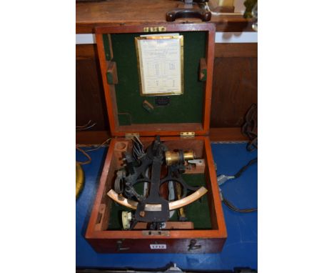 An antique mahogany cased sextant, the case labelled 'F Robson & Co'.