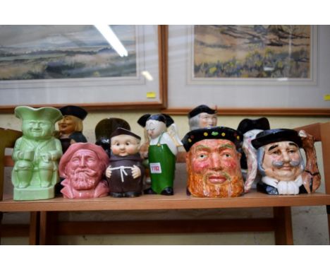 A collection of Victorian and later Toby jugs, to include a Hummel monk example; together with an Robj figure of an angel, 18