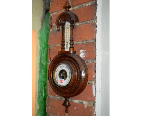 A walnut aneroid barometer. 