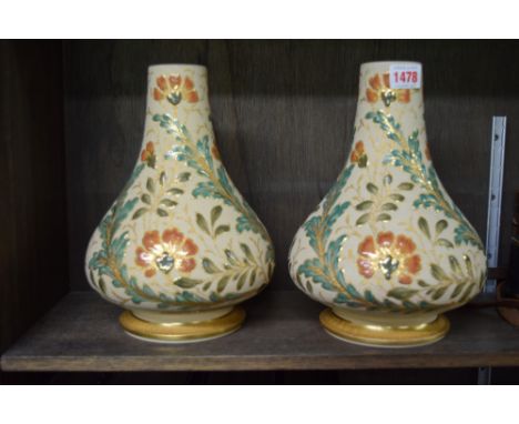 A pair of late 19th century stoneware oil lamp vases, possibly oil lamp bases, 27cm high.  Condition Report: One vase has a c