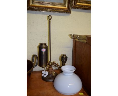 A vintage brass student's lamp.