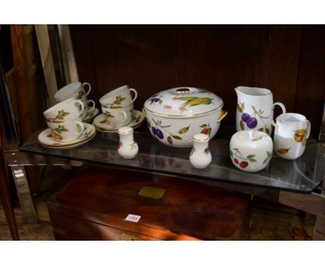 A Royal Worcester 'Evesham' pattern part tea service; together with a tureen and cover; and a pair of pepperettes. 