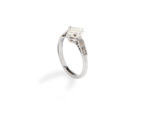 A 1940s diamond single-stone ring set with a square French-cut diamond, each shoulder set with two French-cut diamonds, to a 