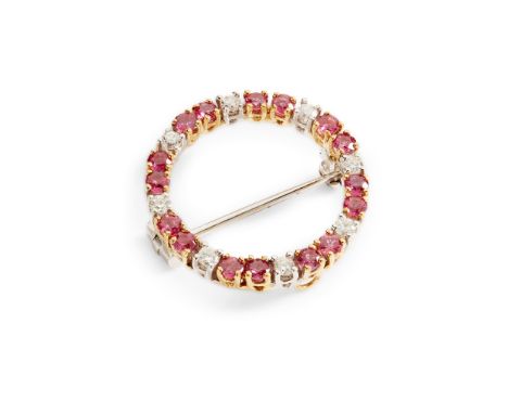 A circular ruby and diamond brooch claw-set with round brilliant-cut diamonds and rubies, modelled in 18ct gold(Diameter: 2.4
