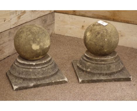 Pair composite stone spherical gate post toppers on stepped bases, 37cm x 37cm