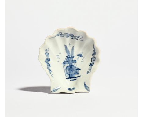 A Lund's Bristol blue and white shell pickle dish c.1748, the scallop shell form painted with a Chinese vase containing tall 