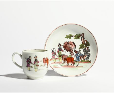 A matched Worcester coffee cup and saucer  c.1756-60, printed in black and hand coloured with the Red Bull pattern, with thre