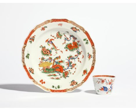 A Worcester plate and a beaker c.1765-70, both richly decorated in the Kakiemon palette, the plate with the Phoenix pattern o