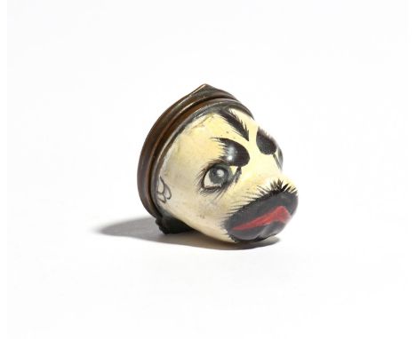 An enamel bonbonnière  c.1770-80, modelled as the head of a pug dog, the hinged cover painted with a dog running in a garden 