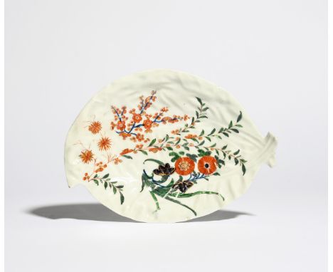 A Worcester leaf dish c.1770, formed of two overlapping cabbage leaves, painted in the Kempthorne manner with flowering prunu