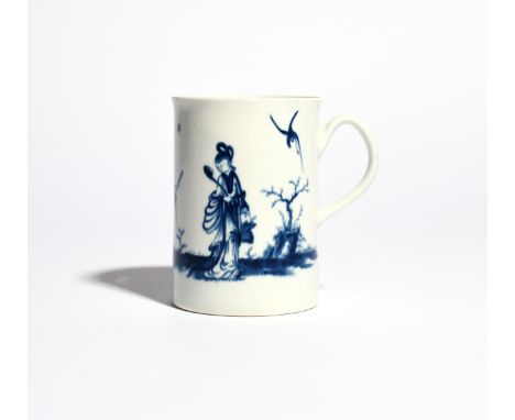 A Worcester blue and white mug c.1765, painted with the Walk in the Garden pattern, a Chinese boy with a bird on the end of a