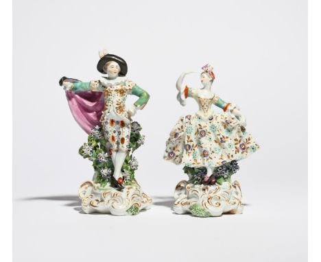 A rare pair of Derby figures of theatrical dancers  c.1765, he standing with one hand on his hip, the other outstretched and 