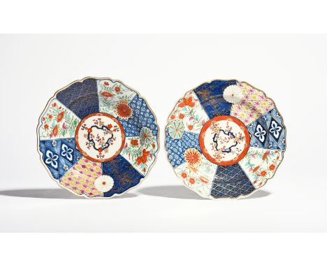 A pair of Worcester plates  c.1770, richly decorated in the Old Mosaic pattern with panels of flowering plants and formal des