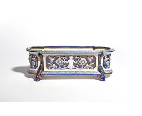 A Royal Worcester jardinière  late 19th century, of low oblong form, moulded in relief with faun terms holding floral and fol