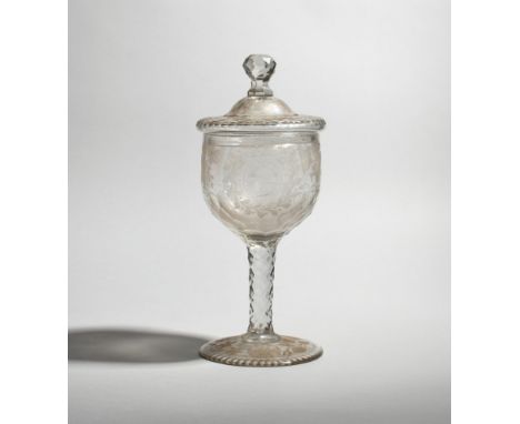 A large commemorative glass goblet and cover  c.1760, the cup-shaped bowl engraved with a profile portrait of Britannia withi