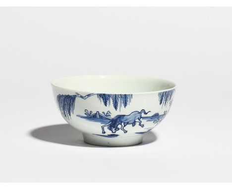 A Vauxhall blue and white slop bowl  c.1755-60, painted with a horse frolicking beneath a fringed tree, the reverse with a si