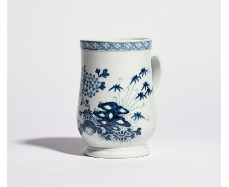 A large Richard Chaffers (Liverpool) blue and white mug c.1760, the generous bell shape painted with flowering chrysanthemum 