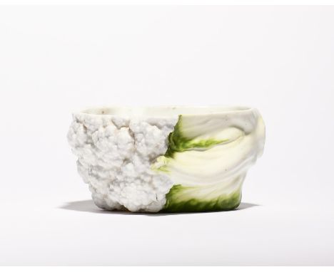 A Worcester cauliflower tureen base  c.1757-60, naturalistically modelled with white florets enclosed by leaves shaded in ton