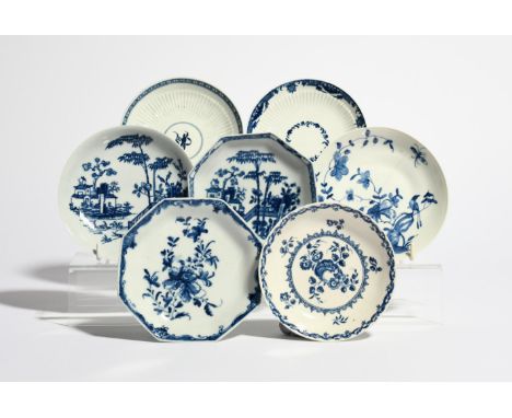 Seven Worcester blue and white saucers  c.1755-65, variously decorated in the Mansfield, Plantation, Two Peony Rock Bird and 