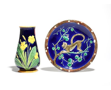 A Wedgwood Majolica small plate  c.1880-90, moulded with a monkey clambering among flowering branches reserved on a blue grou