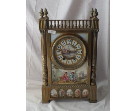 Decorative brass mounted clock with porcelain plaque   