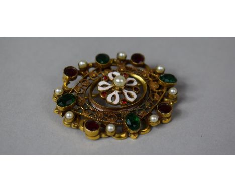 An Edwardian Gilt Metal and Pinchbeck Brooch with Coloured Glass Jewelled and Enamel Decoration 