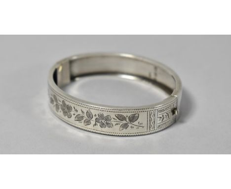 A Silver Bangle, Birmingham 1884 with Engraved Foliate Decoration 