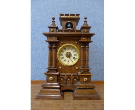 An early 20th Century oak cuckoo mantel clock 