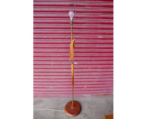 A teak standard lamp 