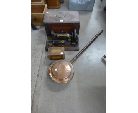 A cased Singer sewing machine, a copper warming pan and a George III inlaid mahogany tea caddy 