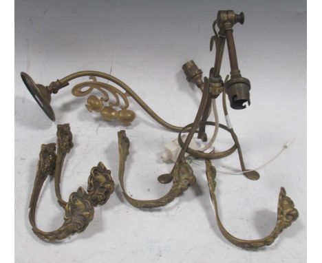 An early 20th century Pullman type brass railway lamp, together with an Art Nouveau wall gas light with floral detail and cas