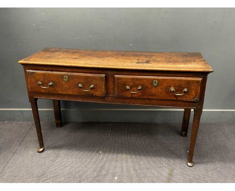 An oak two drawer side table or dresser base, 18th century and later82cm x 134cm x 48cmsurface honest patinated condition con