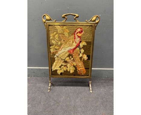 An Art Nouveau brass fireguard with tapestry of a parrot81 x 55 x 18cm