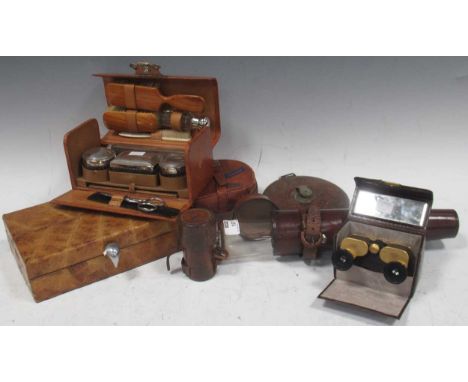 A collection of leather cased items: Telescope; Zeiss binoculars; glass flask; traveling vanity case; stud box