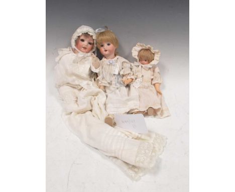 Trio of Bisque head dolls: bisque-head character doll, with lashed dark blue sleeping eyes, mouth open to show top four teeth