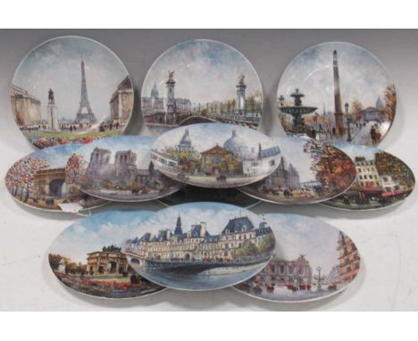A series of twelve Limoges collectors pictorial plates of Parisian scenes signed Louis Dali