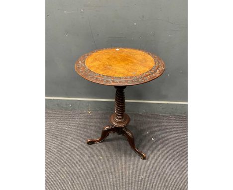 A late Victorian oak tripod table with walnut top and twist carved leg and foliate feet70 x 50cm