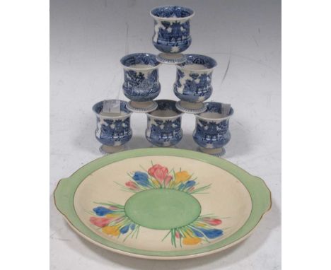 A Clarice Cliff Spring Crocus pattern platter; Together with a set of six Wedgwood Willow pattern egg cups
