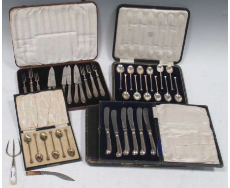 Five cased sets of spoons and fruit knives, a bread fork, a miniature silver Khukri