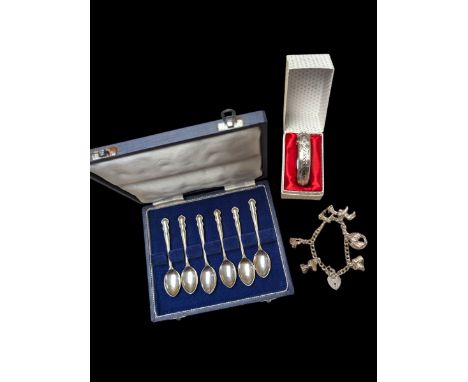 Silver charm bracelet, silver bangle, and cased set of silver spoons, all hallmarked Condition Report:Silver approx 97.9 gram
