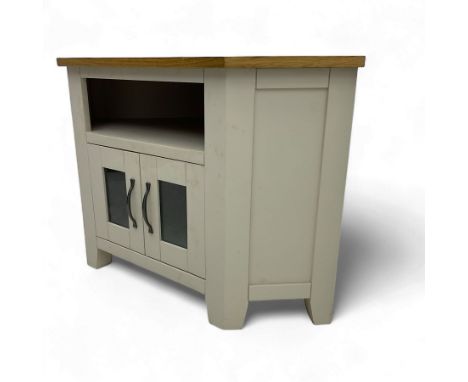 Contemporary cream-painted corner television cabinet, oak top over open shelf and double glazed cupboard below, on shaped fee