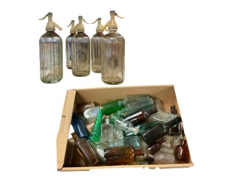 Five Schweppes soda water bottles, together with other vintage glass bottles 