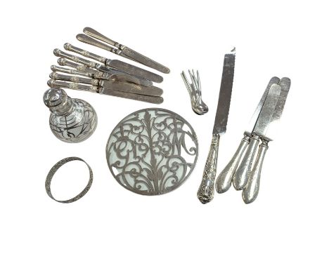 Commemorative silver mounted glass teapot stand, five Danish silver coffee spoons, four silver handled knives, silver mounted