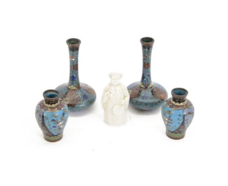 Pair of small Japanese Cloisonne bottle form vases, each decorated with foliate panels against a blue ground, H13cm, a simila