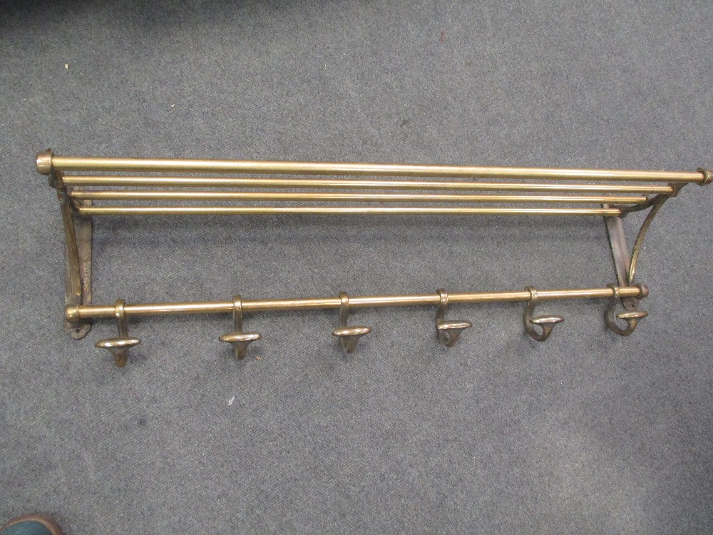 A brass luggage rack with coat hangers, 91cm wide in Cheffins Fine Art