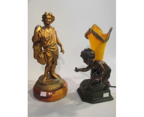 A modern bronzed figural lamp, another lamp and a statue (3)  