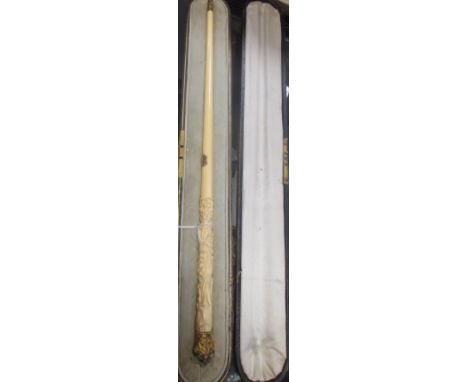A late 19th century ivory conductor's baton with carved lily of the valley on the ivory handle and gilt metal tips, with pres
