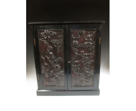 A Chinese panelled cabinet 52 x 47 x 24cm  