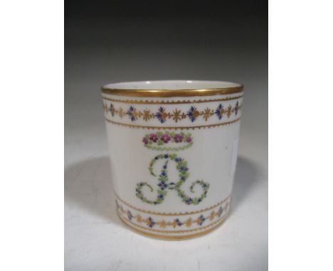 An 18th century English porcelain coffee can, possibly Derby, enamelled with the initial 'R' within floral borders  
